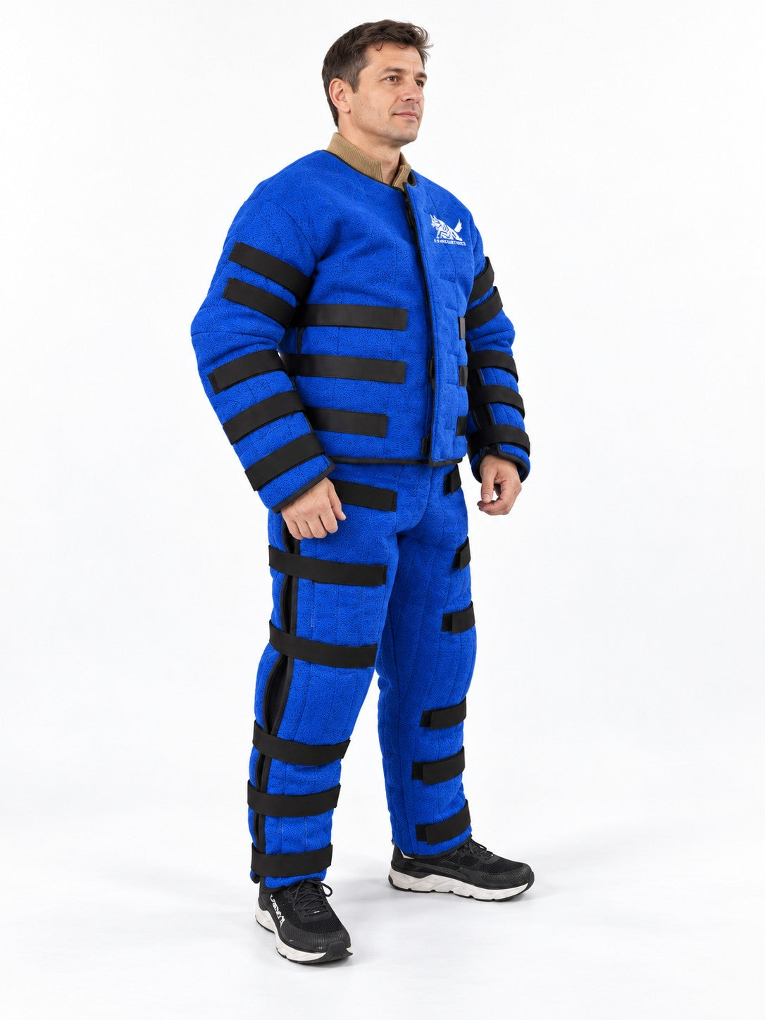 Decoy wearing the K9-Industries hidden bite suit with Velcro adjustment straps, three-quarter view
