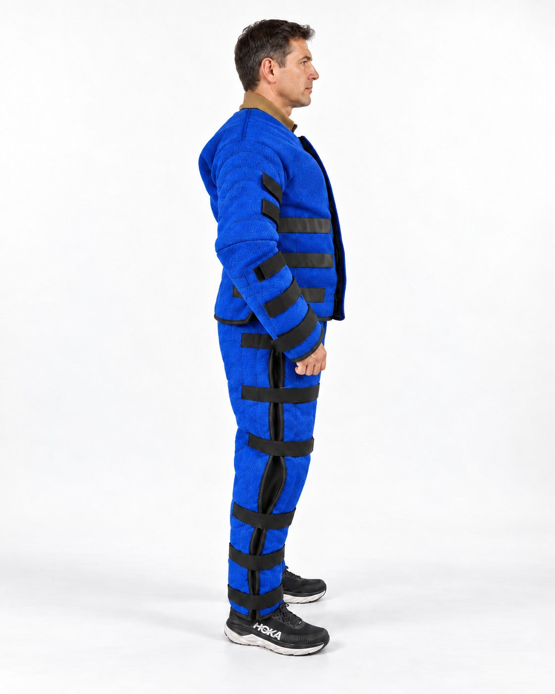 Side view of the K9-Industries hidden bite suit with Velcro straps on arms, waist and legs